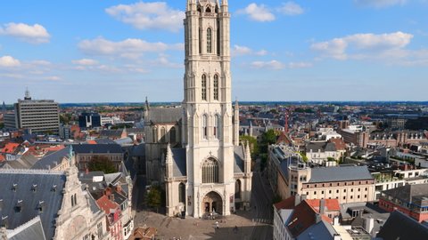 Ghent, Belgium,circa October 2019. Aerial panorama of Saint Bavo cathedral and Gent cityscape from the Belfry of Ghent on a sunny day. Beautiful architecture and landmark of the medieval city