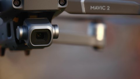 BUDAPEST, HUNGARY - SEPTEMBER 25, 2018: DJI Mavic 2 Pro drone hovering camera tilting down slowly shooting movie. A major upgrade over the previous Mavic model