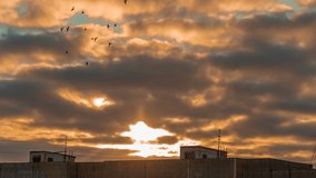Cloudy sky 4K time lapse. City skyline and dramatic sunset with clouds and orange sky. Natural background, cloudscape. Wind energy. - Powered by Shutterstock - Get 15% off with code: PIKWIZARD15