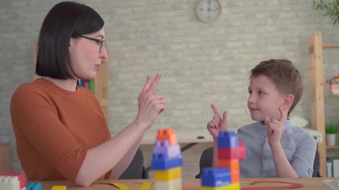 Preschooler engaged with a speech therapist