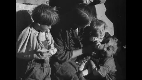 CIRCA 1942 - Migrant families of destitute farmers include very young children.