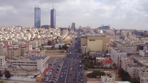 AMMAN, JORDAN - CIRCA 2019 - aerial over the city of Amman, Jordan downtown business district and traffic.