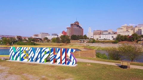 MEMPHIS, TENNESSEE - CIRCA 2010s - Aerial over Memphis sign on Mud Island looking towards Memphis Tennessee downtown skyline.