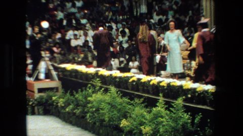 LANSING MICHIGAN-1983: Students Walking Across The Stage And Being Handed Their Diplomas