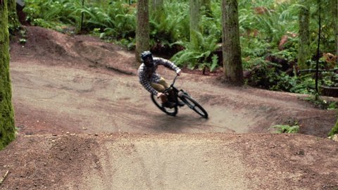 Head on Shot of BMX Biker Launching Dirt Jump Slow Motion