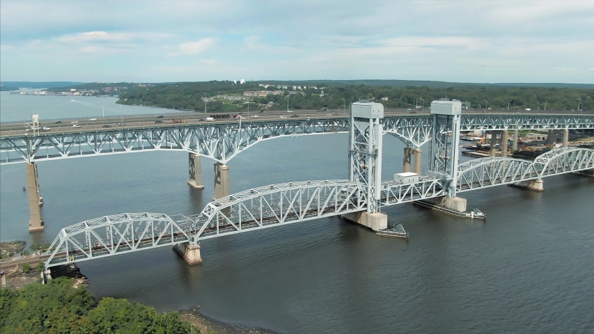 Aerial: Traffic on the Gold Star Memorial Bridge & Thames River. New London, Connecticut, USA 