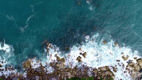 Aerial view of crashing waves on rocks landscape nature view and Beautiful tropical sea with Sea coast view in summer season footage Drone top down High angle view