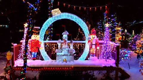 Christmas magic castle lighted display, walking bridge over stream, Stoneham Massachusetts USA, December 8, 2019