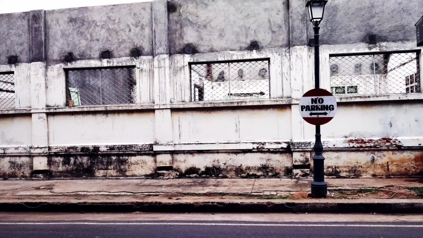 Caution board NO PARKING displayed at the road side. 02