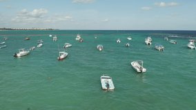Flying Over Parked Boats Ending in Spectacular View of Turquoise Caribbean Sea