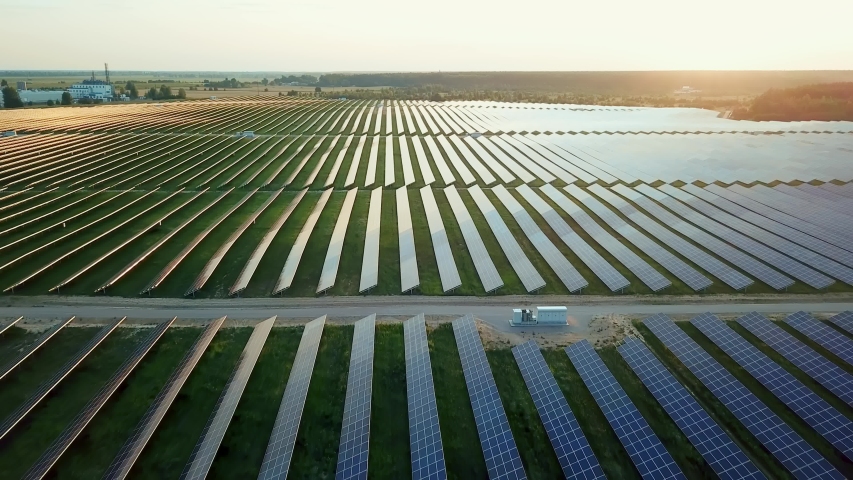 aerial view of solar power station, Aerial Top View of Solar Farm with Sunlight, Renewable Energy, Aerial shot of Solar Power Station Royalty-Free Stock Footage #1042557988
