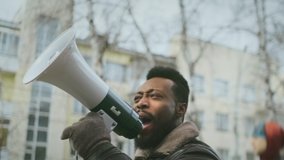 African american man hold megaphone. Shout out. Political rally. Social activist speak outdoor against. Black Resistance rebellion. Requirement activity. Opposition public mass. George Floyd racism.  - Powered by Shutterstock - Get 15% off with code: PIKWIZARD15