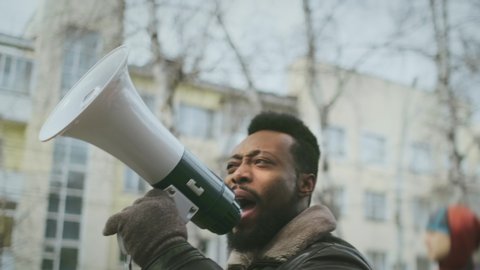 African american man hold megaphone. Shout out. Political rally. Social activist speak outdoor against. Black Resistance rebellion. Requirement activity. Opposition public mass. George Floyd racism. 