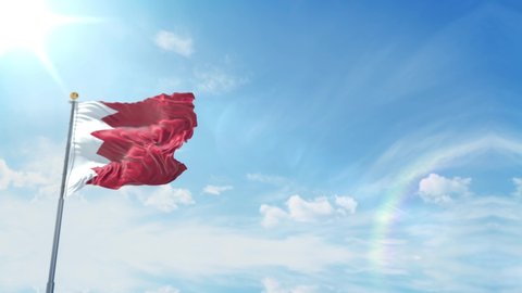Realistic flag of Bahrain waving against blue Sky background. 
Flag of the Bahrain 4K resolution  