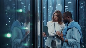 IT head administrator teaching young technician internet technologies in database. Diverse female and male server specialists coworking in server cabinet of cyberspace. - Powered by Shutterstock - Get 15% off with code: PIKWIZARD15