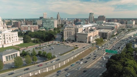 Aerial over the Rhode Island State House, freeway traffic & downtown Providence, Rhode Island, USA. 27 August 2019