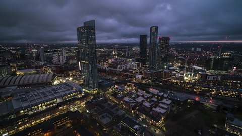 Establishing Aerial View Shot of Manchester UK Skyline England United Kingdom at evening night