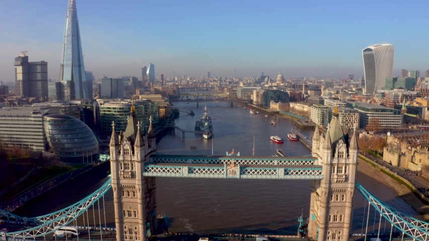 Beautiful aerial view of the Tower bridge in London, UK. Flying over the city with a magnificent London skyline view. Royalty-Free Stock Footage #1042617670