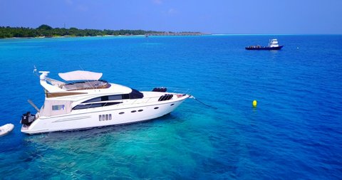 extravagance boat arrived at excluded vacation location in Bali, wealthy luxury yacht docked in ocean outside of holiday island