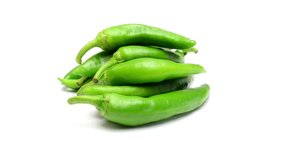 fresh bio green pepper rotating on white background