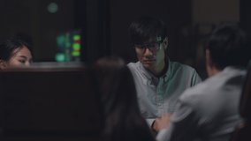 Millennial Asia businessmen and businesswomen meeting brainstorming ideas about new paperwork project colleagues working together planning success strategy enjoy teamwork in small modern night office. - Powered by Shutterstock - Get 15% off with code: PIKWIZARD15