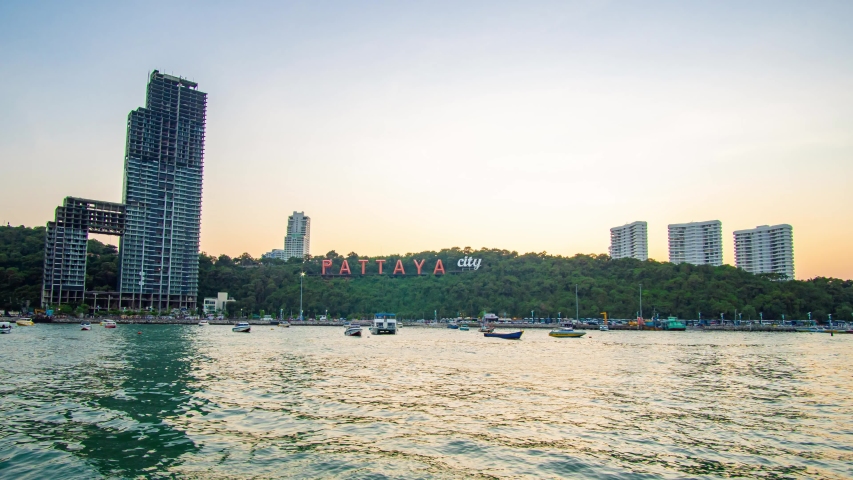 4k Time lapse Beautiful view during sunset with twilight and golden sky at pattaya city sign near Balihai bay. Famous place for tourist near Bangkok,Thailand.
