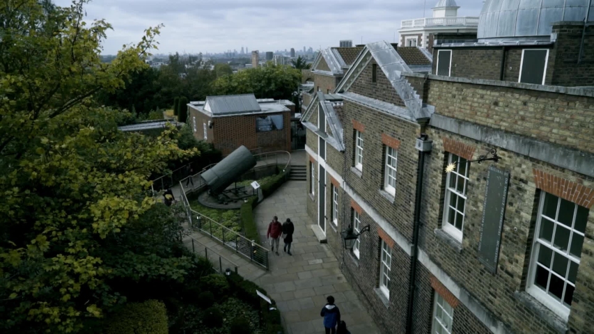 Old houses with European architecture in city. Action. European houses with ancient architecture of dark brick. Old architecture of houses of European cities attracts tourists