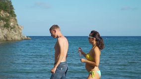 Young Woman Applying Sunscreen to her Husband in Slow Motion. Family Using Sunblock Cream to Protect from Sun during Summer Sea Vacation. Healthcare and Sun Protection at Travel Time Concept - Powered by Shutterstock - Get 15% off with code: PIKWIZARD15