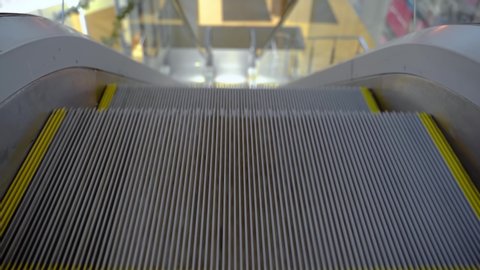 Empty escalator is moving up. Electric Stair, escalators in a public area. 