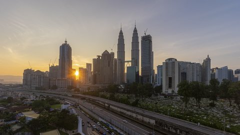 High angle Time lapse of sunrise in Kuala Lumpur city in Malaysia. Zoom in motion timelapse. High quality, Prores Full HD