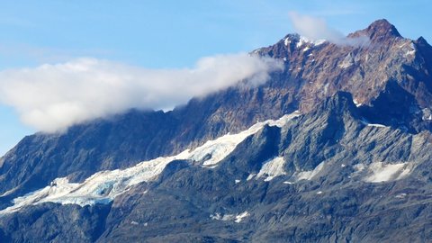 Close up view of snow capped mountains in Alaska. Glacier Bay National Park during sunny day