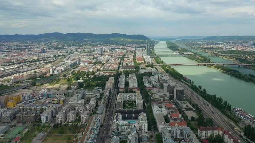 flight over vienna city sunny day riverside aerial panorama 4k austria