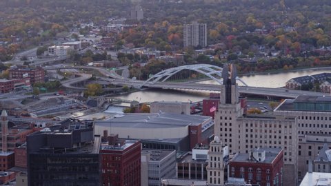 Rochester New York Aerial v35 Panning downtown cityscape at sunrise with glare - October 2017
