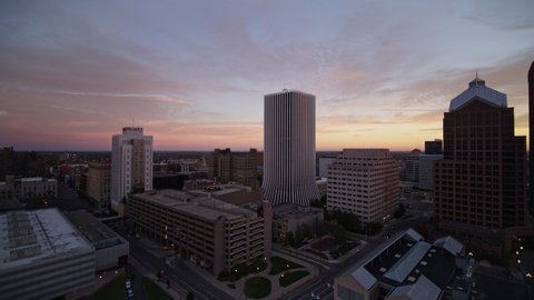 Rochester New York Aerial v29 Panning low around downtown at sunrise - October 2017