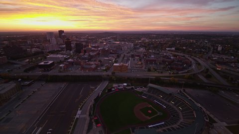 Rochester New York Aerial Panning cityscape at dawn sunrise from ballpark to river - October 2017