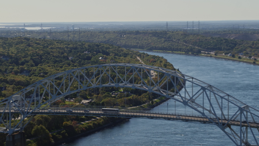 Cape Cod Massachusetts Aerial Panning birdseye with Sagamore bridge and its traffic in forefront - October 2017 Royalty-Free Stock Footage #1042726363