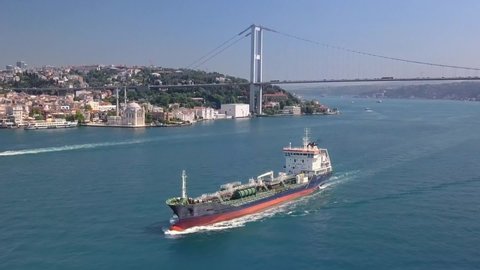 Oil chemical tanker sailing along the Bosporus shore in Istanbul City. Aerial. Oil Tanker traffic is getting denser as the need for the transportation of Asian and Caucasian petroleum increases
