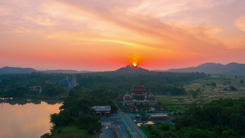 Aerial video of Wat Yannasang Wararam Buddhist Temple with sunrise in the morning, Pattaya city of Thailand.
