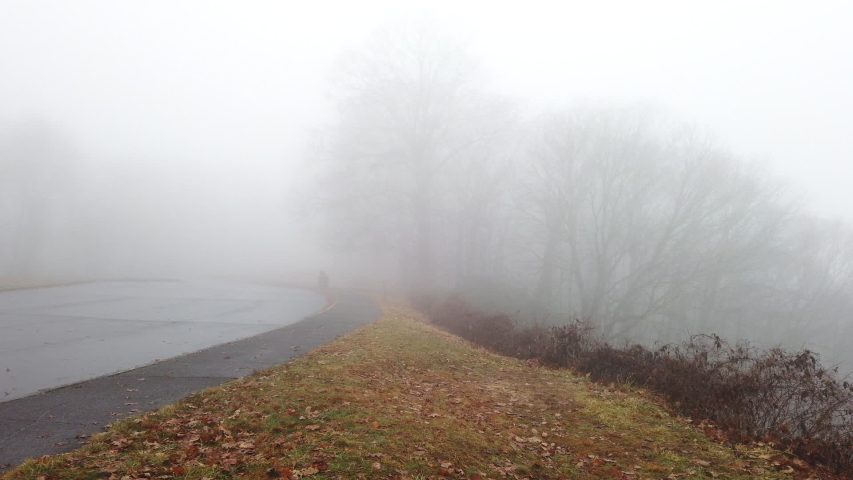 Fog rolling in on the Blue Ridge Parkway highway in the mountains of the Great Smoky Mountains National Park.