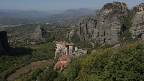 View from Meteora rocks with St. Nikolaos Anapafsas monastery 4K video