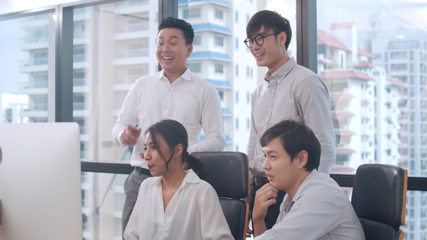 Millennial group of young businesspeople Asia businessman and businesswoman celebrate giving five after dealing feeling happy and signing contract or agreement at meeting room in small modern office. Royalty-Free Stock Footage #1042775209