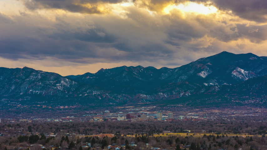 Colorado Springs, Colorado, USA downtown skyline and mountains at dusk.