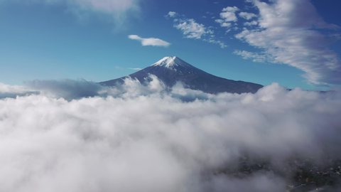 Aerial view 4k video by drone of Mount Fuji and mist at yamanashi , Japan on morning.
