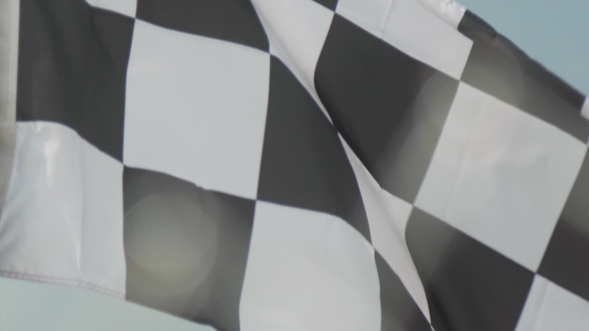 A Checkered Flag Waves in Stock Footage Video (100% Royalty-free ...