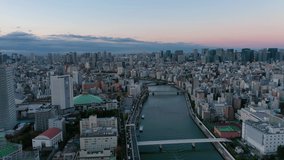 Aerial view 4k video by drone of building in Tokyo city, Japan on sunrise.