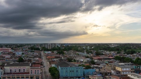 Time Lapse of an Aerial Panoramic view of a small Cuban Town, Ciego de Avila, during a cloudy and colorful sunset. Located in Central Cuba.