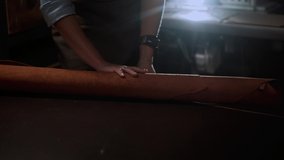 Close up craftswoman working with leather belt. Shoe production process in factory. Close up leather craftsman working with natural leather using hammer. Handmade concept, Working process with leather - Powered by Shutterstock - Get 15% off with code: PIKWIZARD15