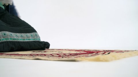 Caucasian Muslim Woman Prostrating and Praying on Carpet, Close Up