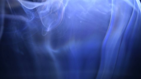 Real Blue Thin Stream Flexible Smoke Trickle footage isolated on black background for your different projects.  Use blending transparent modes.