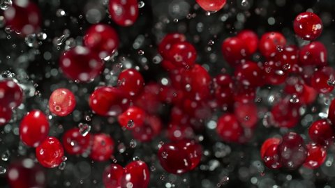 Super Slow Motion Shot of Cranberries and Water Explosion Towards Camera at 1000fps.